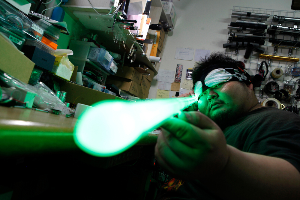 Makoto Tsai, who handcrafts lightsabers for 'Star Wars' fans, poses for a photograph at his workshop in New Taipei City April 22, 2019. — AFP pic 