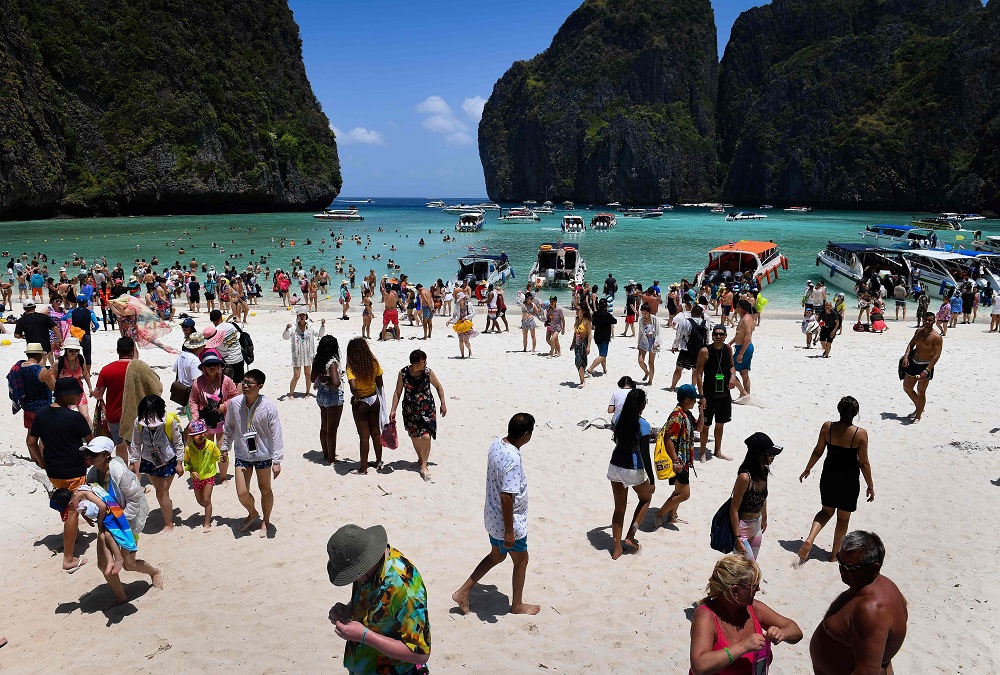 This photo taken on April 9, 2018 shows a crowd of tourists on Maya Bay beach, on the southern Thai island of Koh Phi Phi. u00e2u20acu2022 AFP pic       