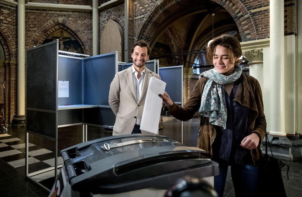 Netherlands far-right party Forum for Democracy (FvD) leader Thierry Baudet watches his fiancee Davide Heijmans casting her ballot for the European elections at a polling station at the Posthoornkerk basilica in Amsterdam, May 23, 2019. u00e2u20acu201d AFP pic