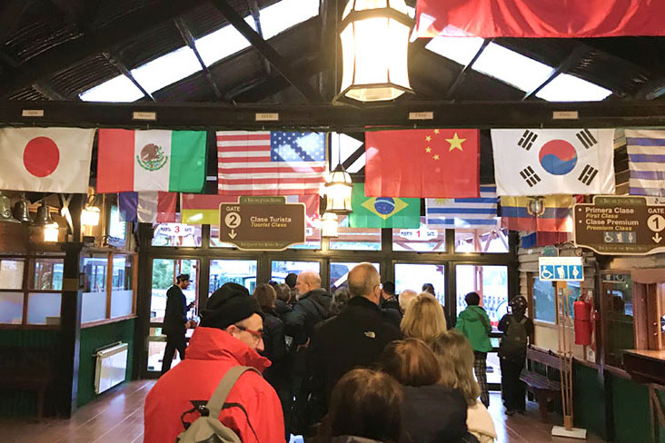 Flags from around the world greet visitors at the Ferrocarril Austral Fueguino (the Southern Fuegian Railway) station 