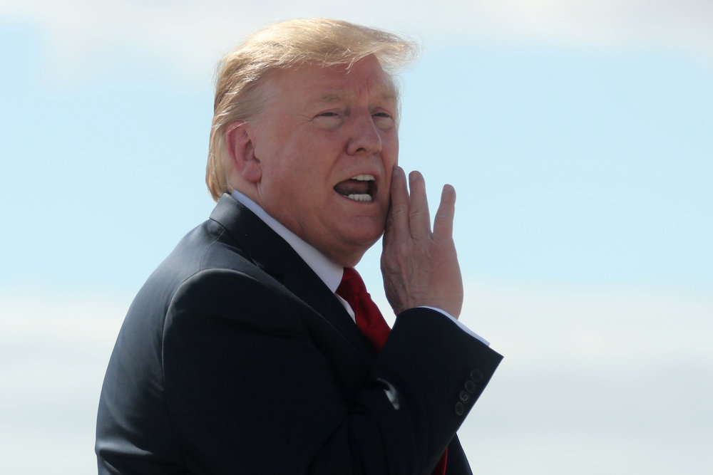 US President Donald Trump shouts an answer to a reporteru00e2u20acu2122s question on the tarmac after arriving aboard Air Force One during a refuelling stop on his way to Japan at Joint Base Elmendorf, Alaska, US May 25, 2019. u00e2u20acu201d Reuters pic