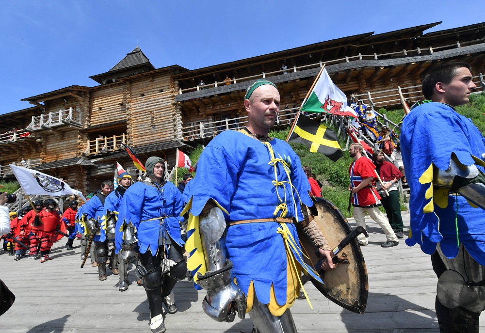 Fighters in heavy knight armour march before a battle during the four-day world championship of Medieval combat fest (IMCF) in medieval fortress near Kiev May 18, 2019. — AFP pic  
