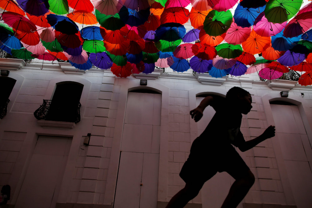 A child runs along a decorated street in Caracas, Venezuela, May 11, 2019. u00e2u20acu201d Reuters pic