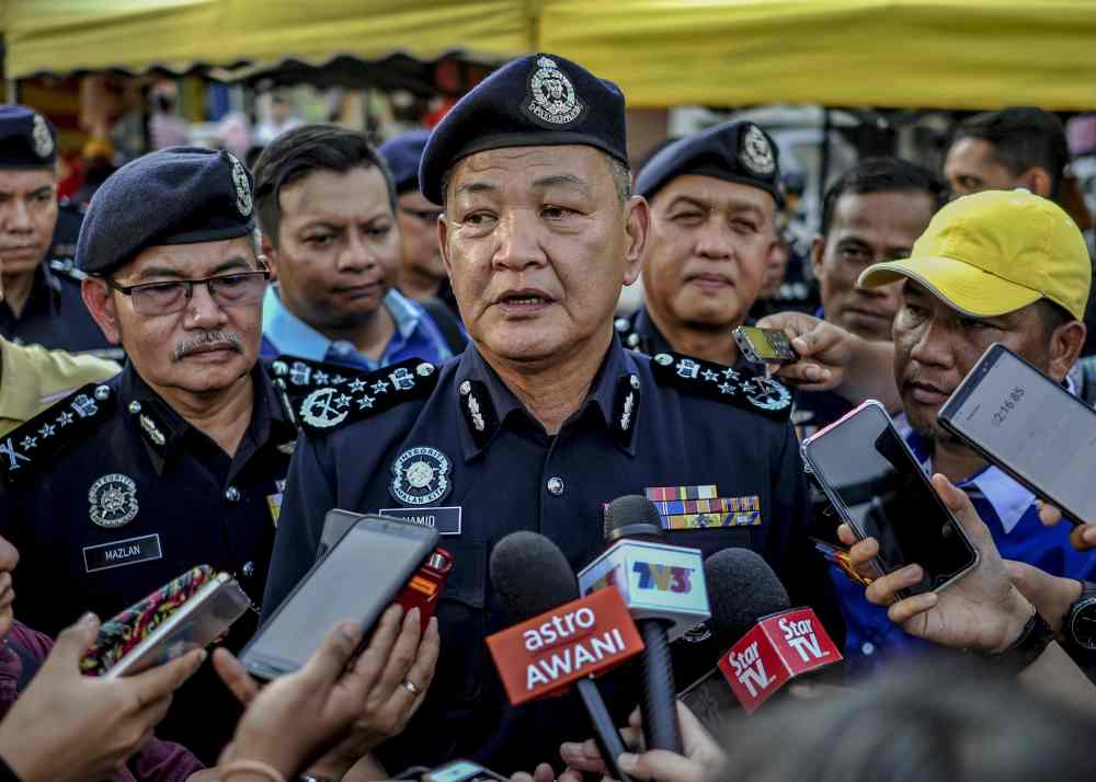 IGP Datuk Seri Abdul Hamid Bador speaks to reporters at the Taman Tun Dr Ismail (TTDI) Ramadan bazaar in Petaling Jaya May 30, 2019. u00e2u20acu2022 Picture by Firdaus Latif