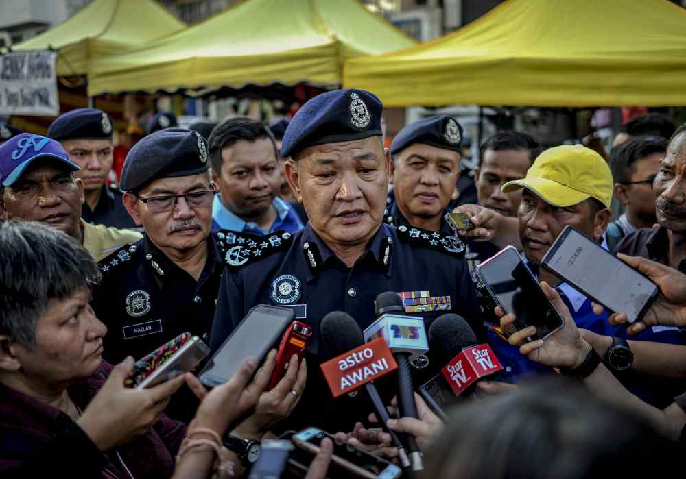 IGP Datuk Seri Abdul Hamid Bador speaks to reporters at the Taman Tun Dr Ismail (TTDI) Ramadan bazaar in Petaling Jaya May 30, 2019. u00e2u20acu2022 Picture by Firdaus Latif