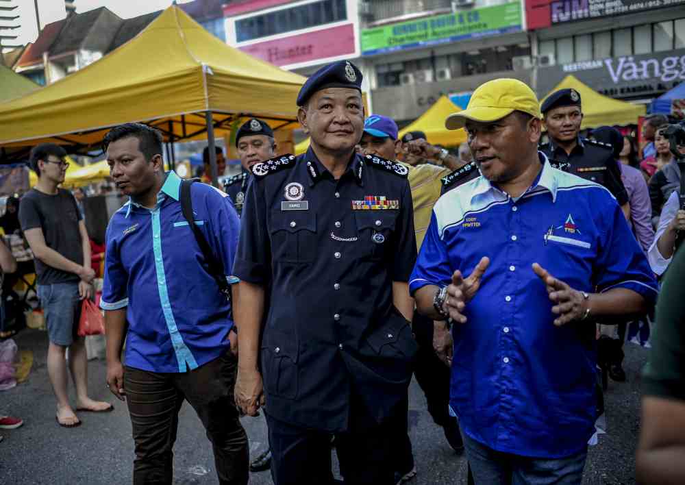 IGP Datuk Seri Abdul Hamid Bador speaks to reporters at the Taman Tun Dr Ismail (TTDI) Ramadan bazaar in Petaling Jaya May 30, 2019. u00e2u20acu2022 Picture by Firdaus Latif