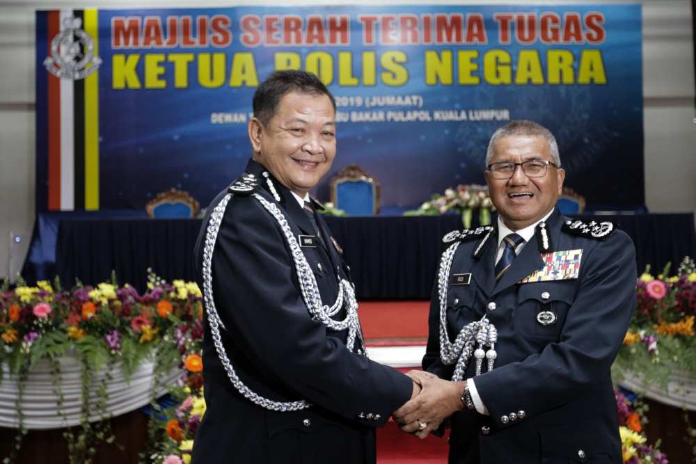 Tan Sri Mohamad Fuzi Harun hands over his duties to newly appointed IGP Datuk Seri Abdul Hamid Bador in Kuala Lumpur May 3,2019. u00e2u20acu2022 Picture by Ahmad Zamzahuri