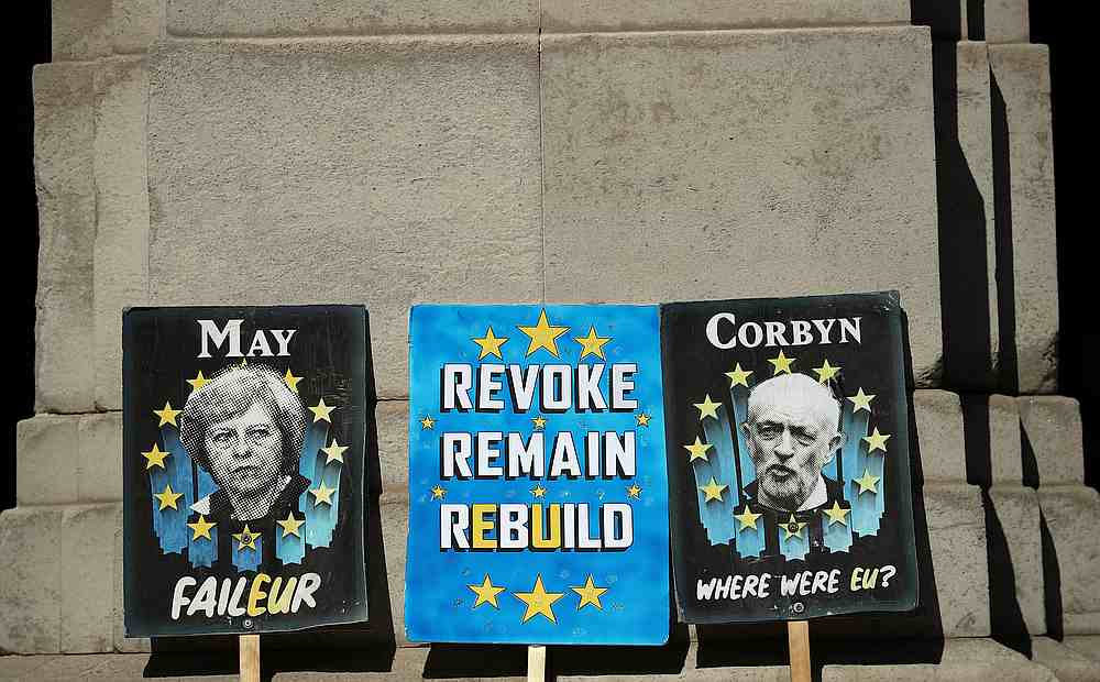 Anti-Brexit placards are seen outside the Houses of Parliament in London May 13, 2019. u00e2u20acu201d Reuters pic