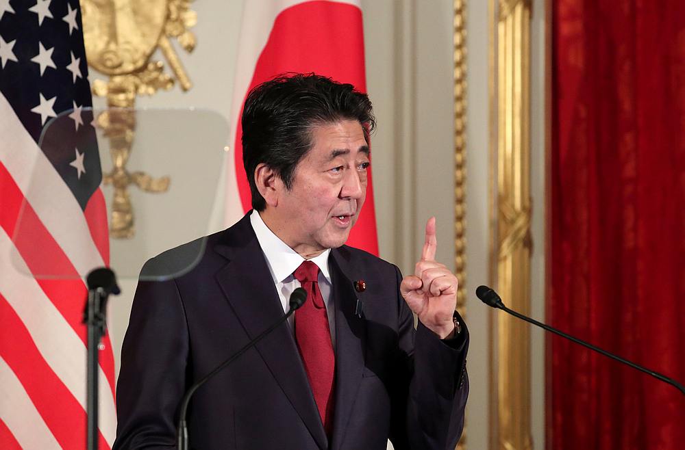 Japan's Prime Minister Shinzo Abe said the government would be working to evacuate any Japanese nationals. — Reuters pic