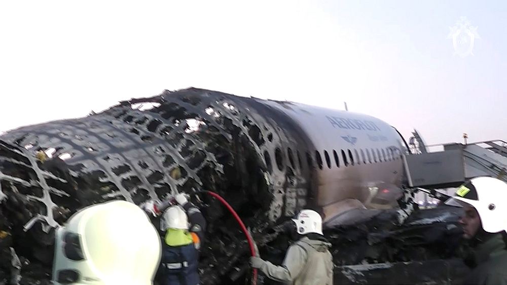 A still image shows members of emergency services work the crash landing of an Aeroflot Sukhoi Superjet 100 at Moscow's Sheremetyevo airport May 6, 2019. u00e2u20acu201d Investigative Committee of the Russian Federation handout via Reuters