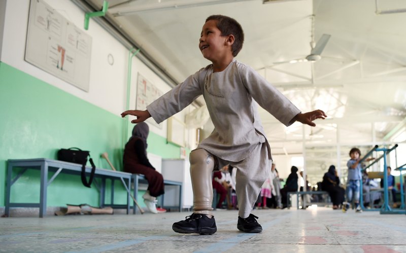 Ahmad Sayed Rahman, a five-year-old Afghan boy who lost his right leg when he was hit by a bullet in the crossfire of a battle, dances with his prosthetic leg at the International Committee of the Red Cross (ICRC) hospital. u00e2u20acu2022 AFP pic