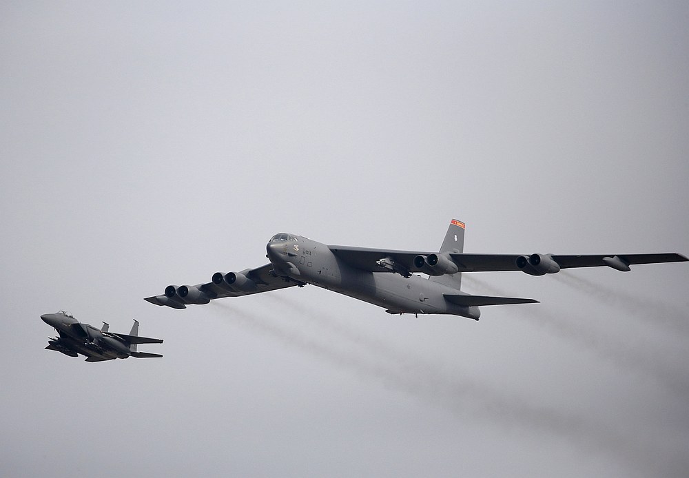 A US Air Force B-52 (right) flies over Osan Air Base in Pyeongtaek, South Korea January 10, 2016. u00e2u20acu201d Reuters pic