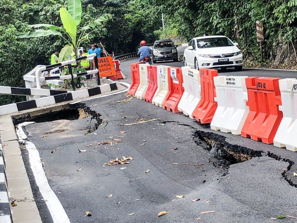 Cracks are seen on a newly repaired road heading to Balik Pulau after heavy downpour in Penang over the past few days. u00e2u20acu201d Picture by Sayuti Zainudin