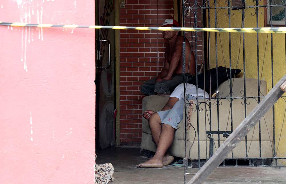 A man is seen next to a body where, according to local media, an armed group had entered and opened fire in a bar, killing and wounding its patrons, in Belem, Para state, Brazil May 19, 2019. u00e2u20acu201d Reuters pic