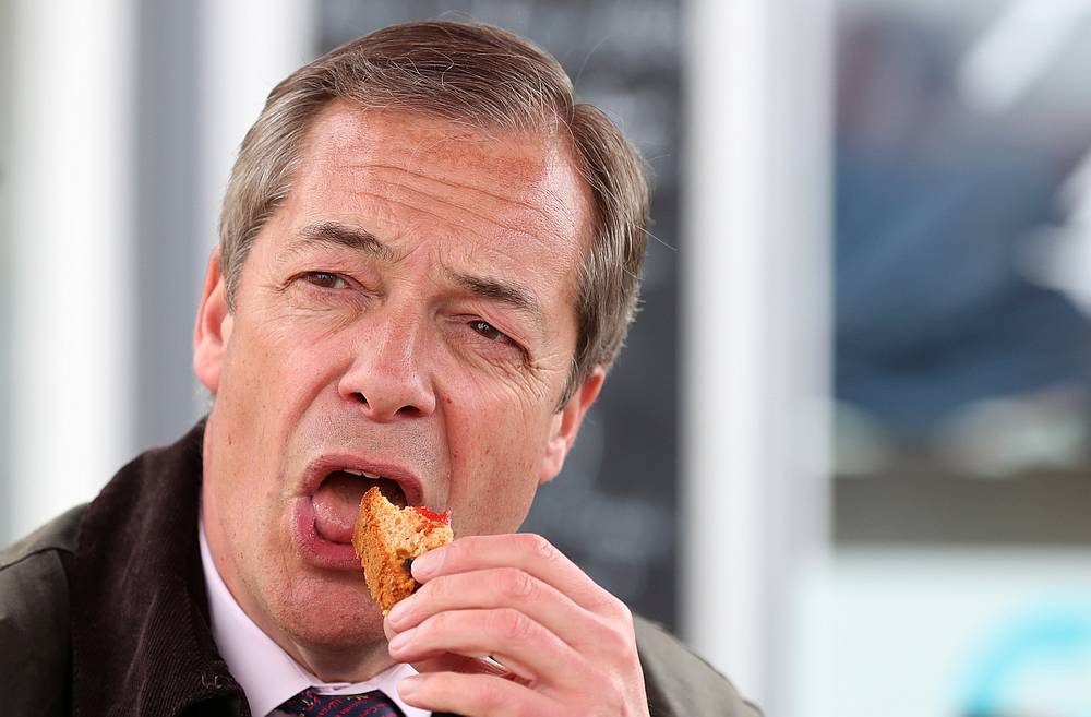 Brexit Party leader Nigel Farage eats a snack during a Brexit Party campaign event in Hartlepool, Britain May 11, 2019. u00e2u20acu201d Reuters pic