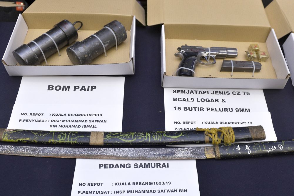 Items seized in anti-terrorism raids last week are displayed during a press conference at the Bukit Aman police headquarters in Kuala Lumpur May 13, 2019. — Picture by Mukhriz Hazim