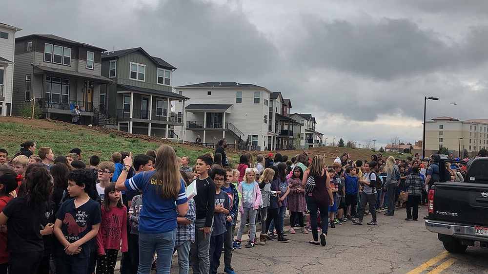 People wait outside near the STEM School during a shooting incident in Highlands Ranch, Colorado, US in this May 7, 2019 image obtained via social media. u00e2u20acu201d Picture by Shreya Nallapati via Reuters