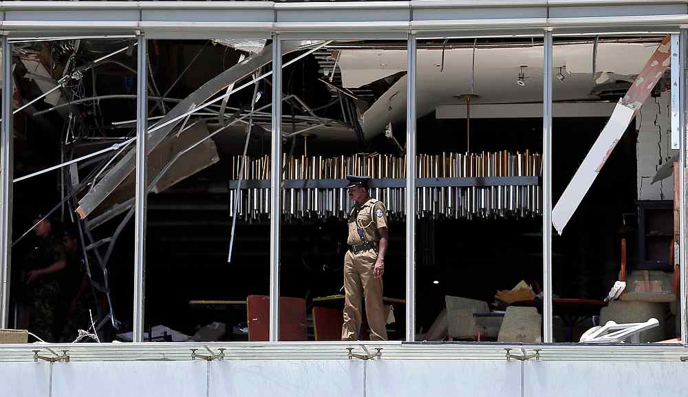 A police officer inspects the explosion area at Shangri-La hotel in Colombo, Sri Lanka April 21, 2019. u00e2u20acu201d Reuters pic