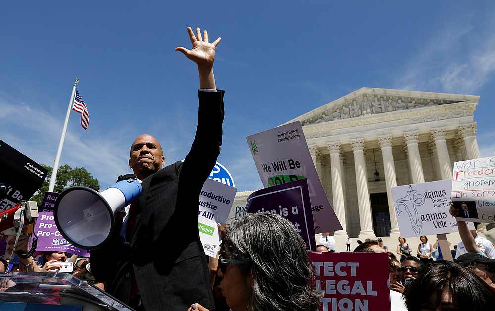 Democratic US presidential candidate Sen. Cory Booker waves to the crowd during a rally outside the US Supreme Court in Washington May 21, 2019. u00e2u20acu201d Reuters pic