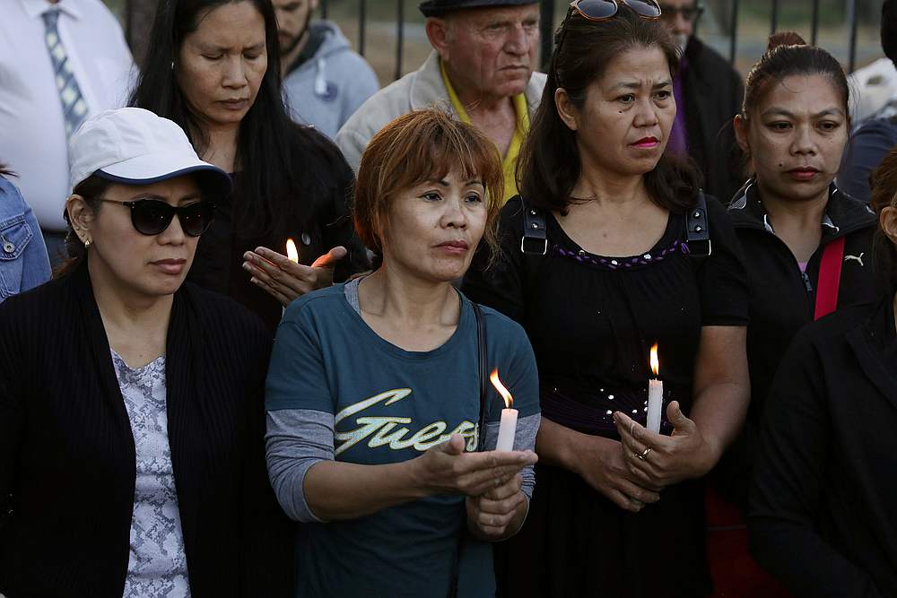 People hold candles during a public gathering in memory of the victims of a suspected serial killer, outside the Presidential Palace in Nicosia, Cyprus May 3, 2019. u00e2u20acu201d Reuters pic