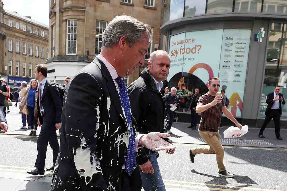 Brexit Party leader Nigel Farage after being hit with a milkshake while arriving for a Brexit Party campaign event in Newcastle, Britain May 20, 2019. u00e2u20acu201d Reuters pic