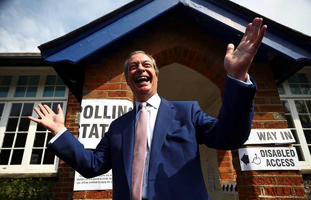 Brexit Party leader Nigel Farage gestures as he leaves a polling station after voting in the European elections, in Biggin Hill, Britain May 23, 2019. u00e2u20acu201d Reuters pic