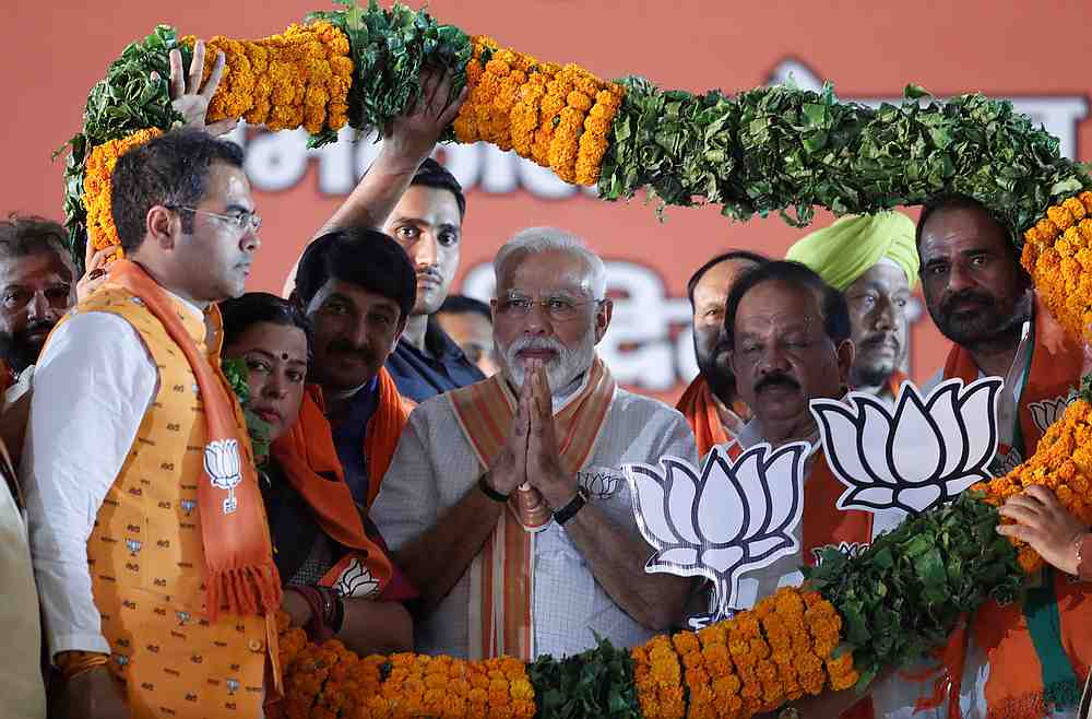 India's Prime Minister Narendra Modi (centre) gestures as he is presented with a garland during an election campaign rally in New Delhi May 8, 2019. u00e2u20acu201d Reuters pic