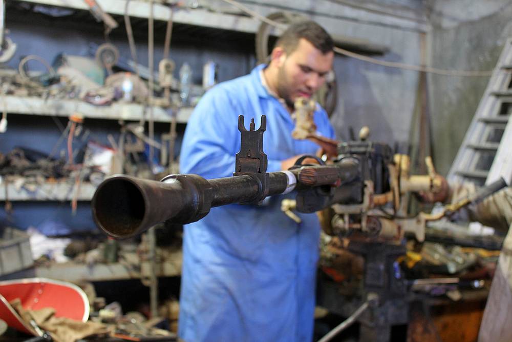 A Libyan volunteer fixes a weapon belonging to the members of the Libyan internationally recognised government forces at a workshop in Misrata May 2, 2019. u00e2u20acu201d Reuters pic