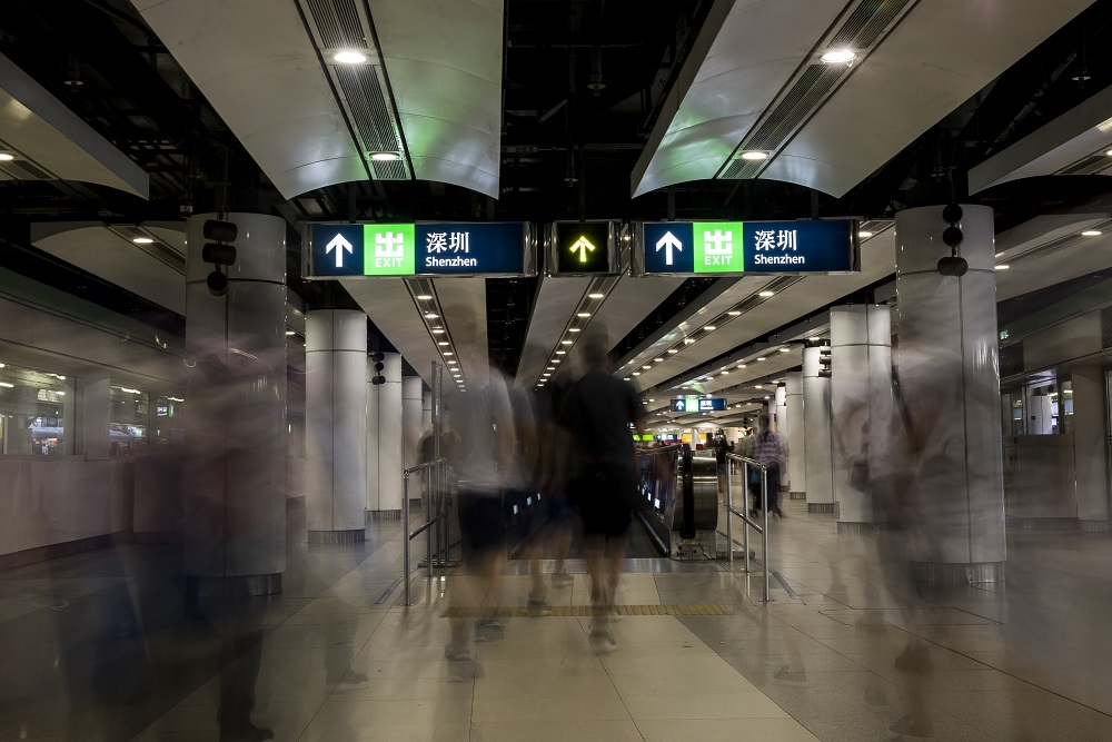 In this photo taken on a slow shutter speed shows passengers walking towards the Hong Kong and Shenzhen boarder at Lo Wu station in Hong Kong May 20, 2019. u00e2u20acu201d AFP pic          