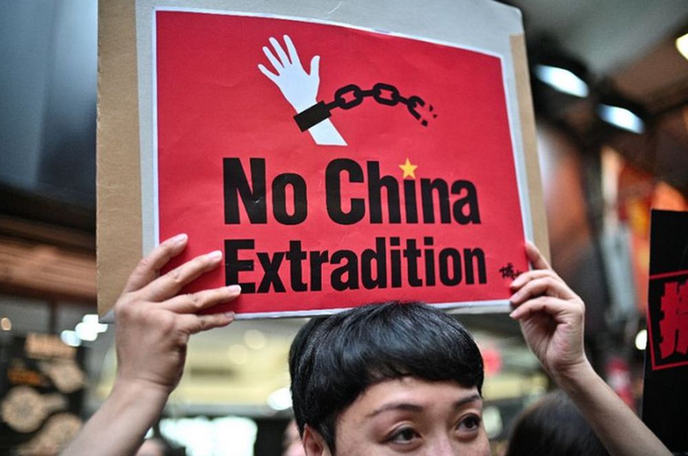 An activist holds a placard against a controversial move by the Hong Kong government to allow extraditions to the Chinese mainland during an April 2019 protest. u00e2u20acu201dAFP pic
