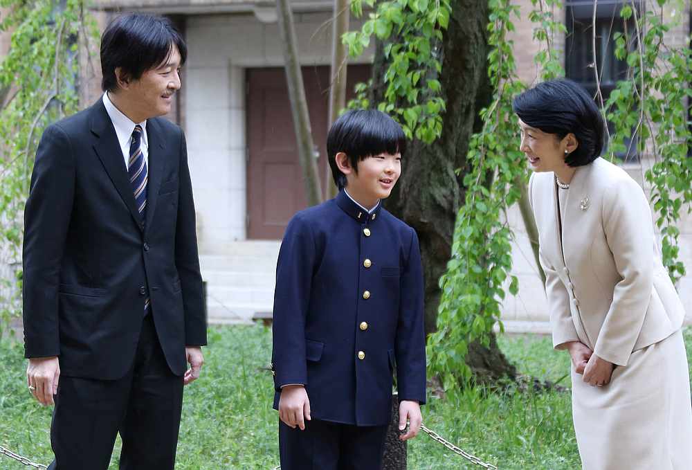 Prince Hisahito talks with his parents Prince Akishino and Princess Kiko at Ochanomizu University junior high school before attending the entrance ceremony in Tokyo, Japan April 8, 2019. u00e2u20acu201d Koji Sasahara/Pool pic via Reuters