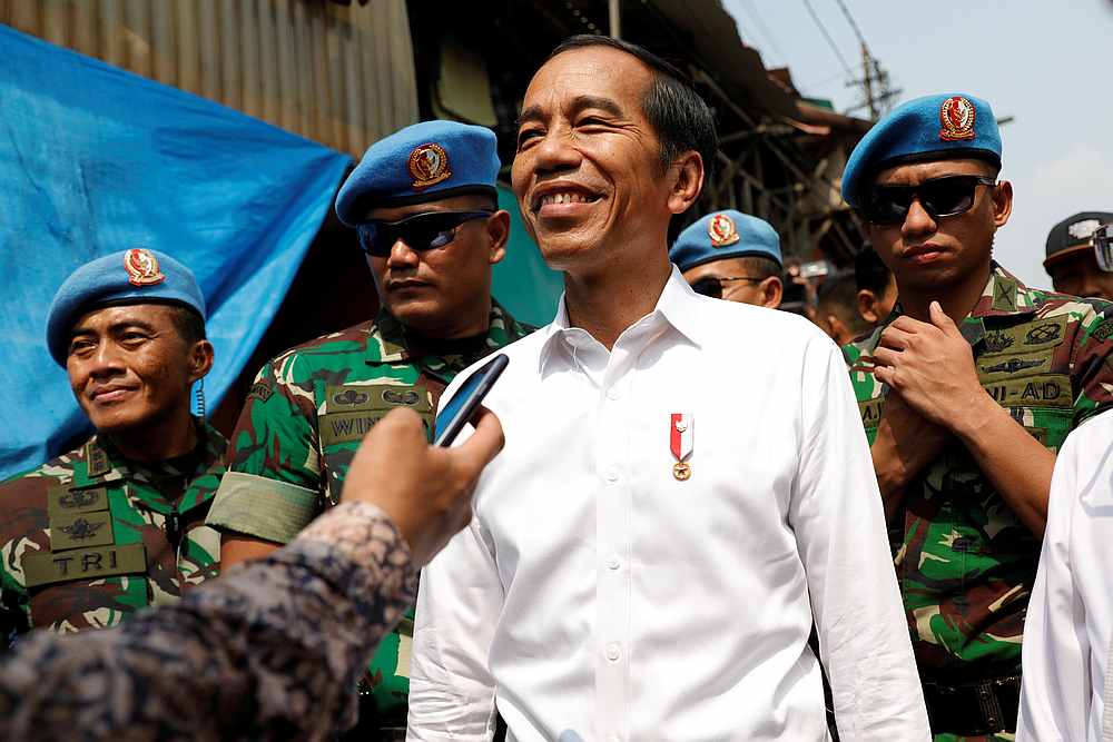 Indonesia's incumbent President Joko Widodo reacts after making a public address with his running mate Ma'ruf Amin, following the announcement of the official presidential election results in Jakarta, May 21, 2019. u00e2u20acu201d Reuters pic