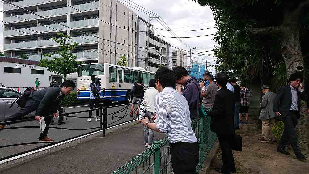People react as police vehicles arrive at the scene of a stabbing at a bus stop at Kawasaki, Japan May 28, 2019. — Social media pic from @_RASSUN5001 via Reuters