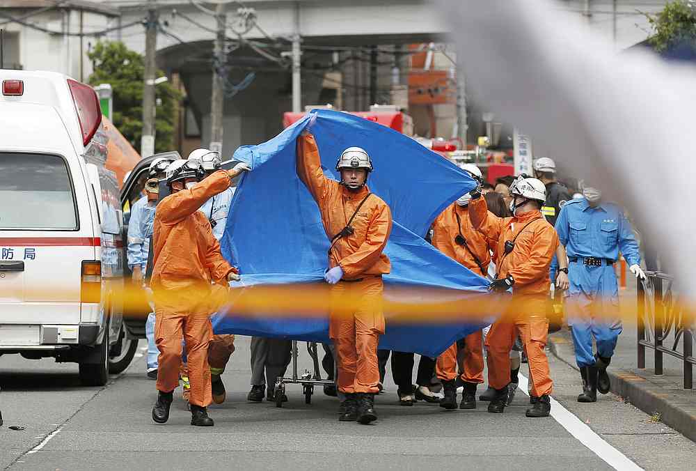 Rescue workers operate at the site where a number people, including children, were injured in a suspected stabbing by a man, in Kawasaki, Japan May 28, 2019. u00e2u20acu201d Kyodo pic via Reuters