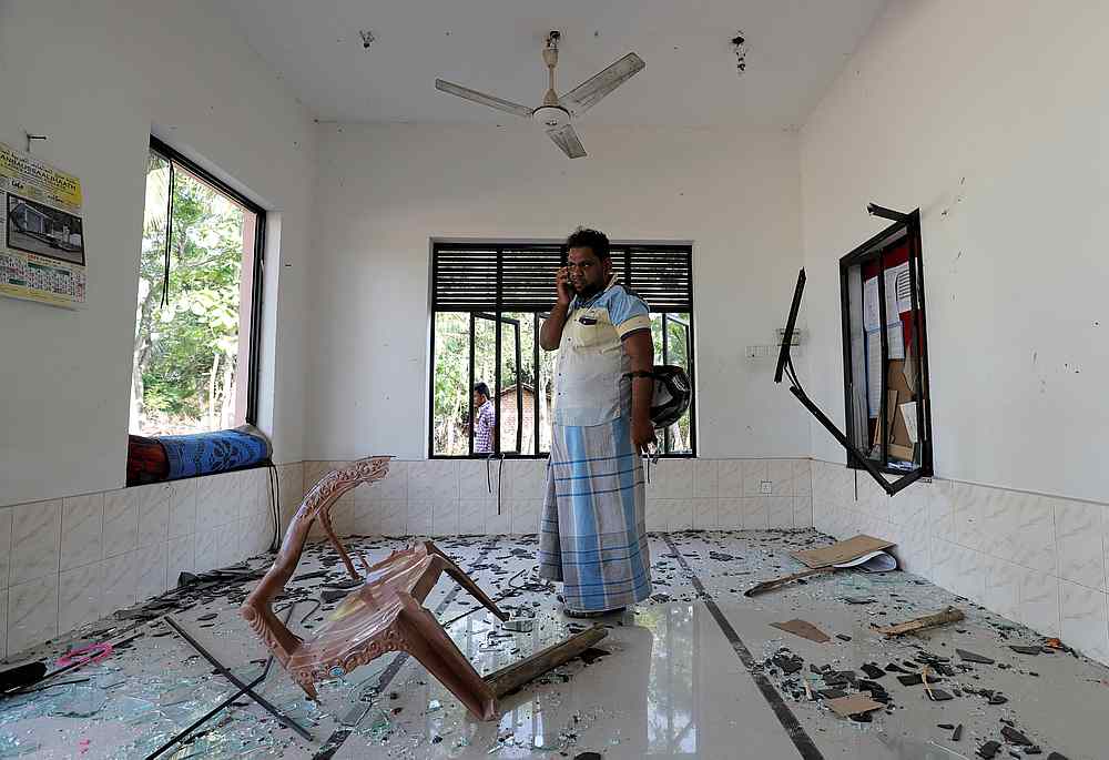A Muslim man stands inside the Abbraar Masjid mosque after a mob attack in Kiniyama, Sri Lanka May 13, 2019. u00e2u20acu201d Reuters pic