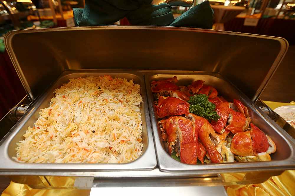 The buffet features a special 'Nasi Ayam' dish with biryani rice. — Picture by Mohd Yusof Mat Isa