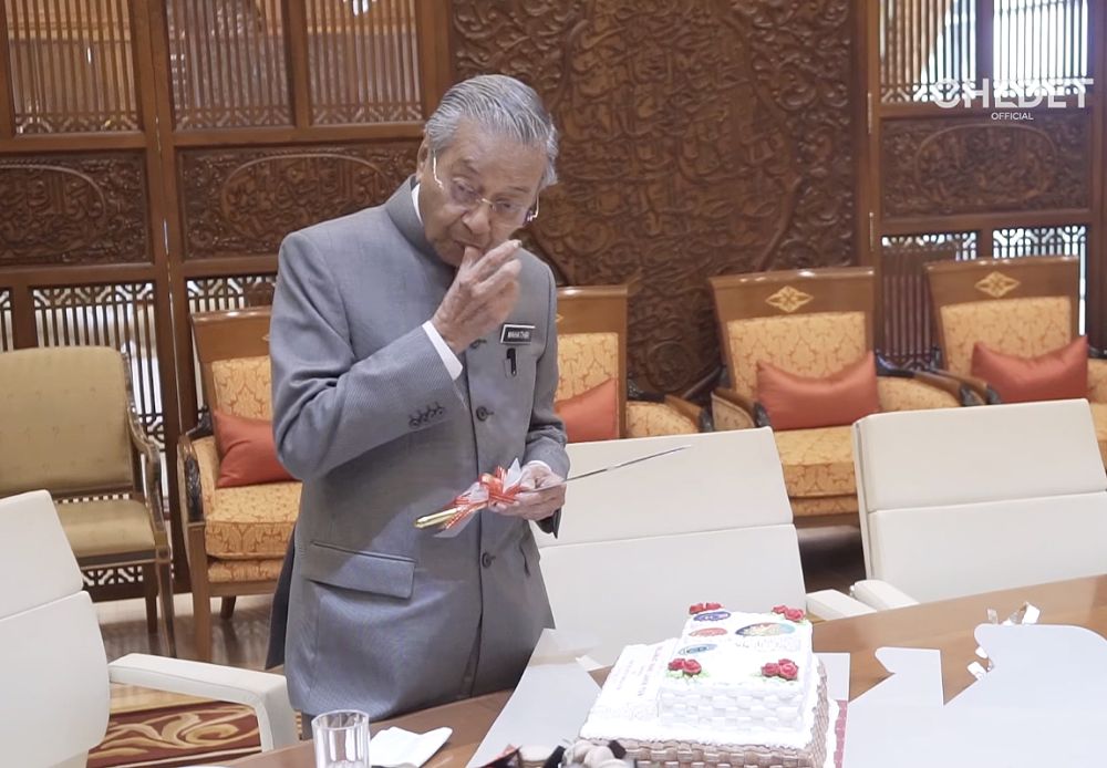 Tun Mahathir has a taste of his 93rd birthday cake on July 10, 2018. — Screengrab from Facebook/Tun Dr Mahathir Mohamad