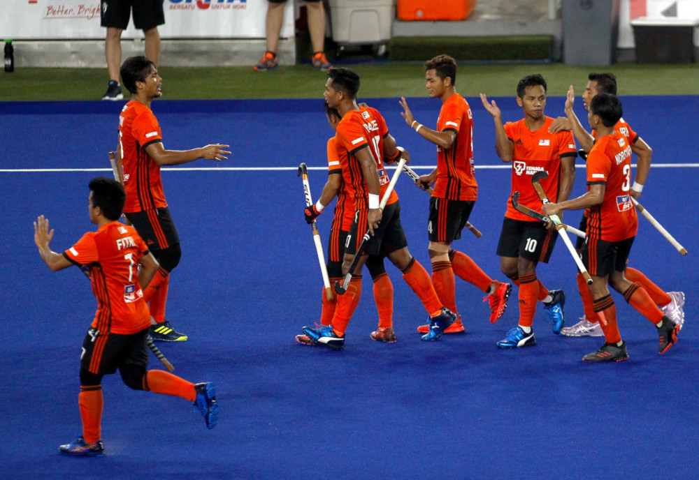 Faizal Saari (second from left) celebrates with his teammates after scoring during the semifinal match against Austria at the National Hockey Stadium, Bukit Jalil, May 3, 2019. u00e2u20acu201d Bernama pic 