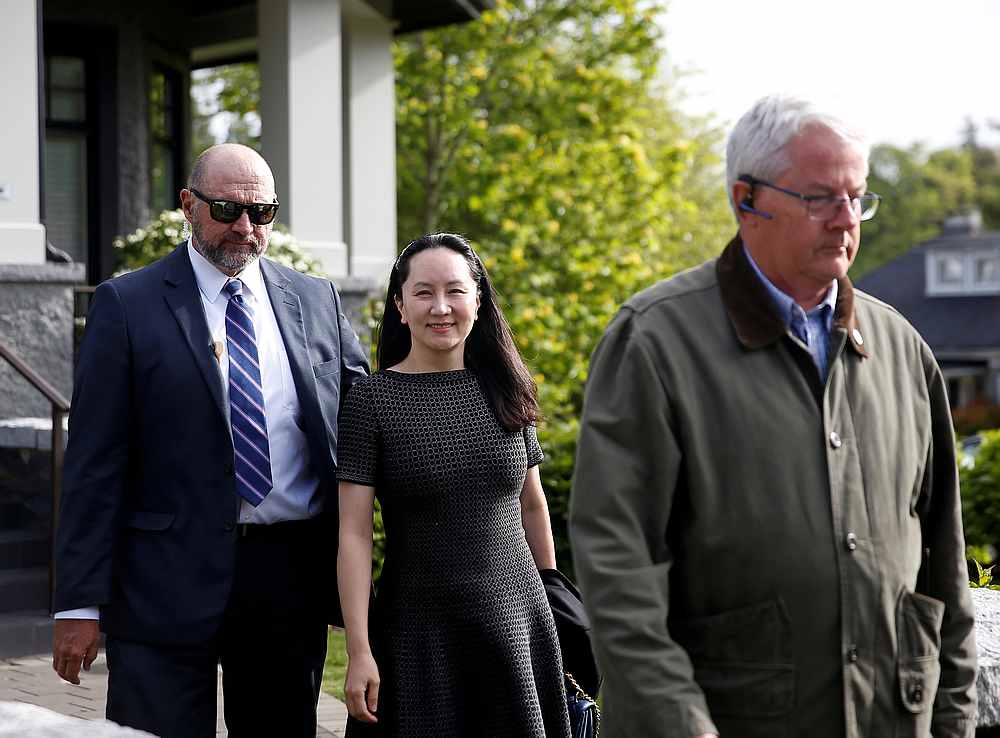 Huawei's Financial Chief Meng Wanzhou leaves her family home flanked by private security in Vancouver, British Columbia, Canada May 8, 2019. u00e2u20acu201d Reuters pic
