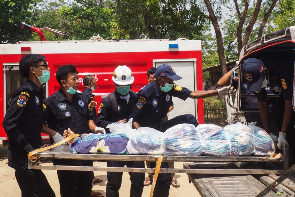 Rescue workers transport the body of a prisoner after a riot in the Shwe Bo prison in Sagaing region on May 9, 2019. u00e2u20acu201d AFP pic