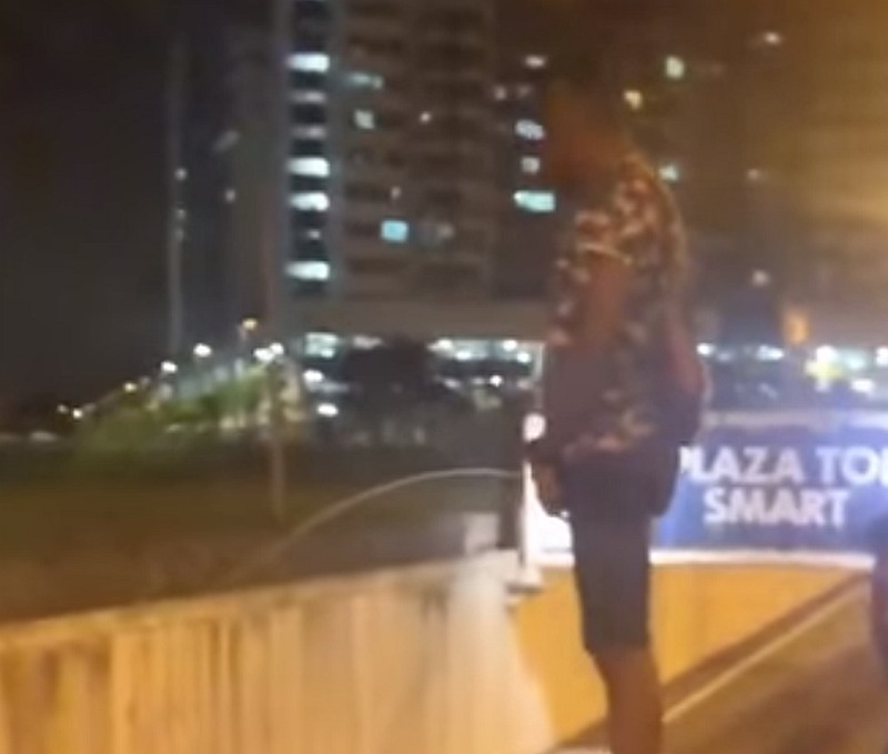 Screengrab from the viral video, featuring a group of young men peeing onto passing cars entering SMART Tunnel in Kuala Lumpur. u00e2u20acu201d Image from Facebook video