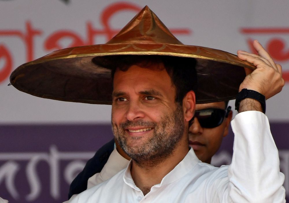 Rahul Gandhi, President of India's main opposition Congress party, wears a u00e2u20acu02dcJapiu00e2u20acu2122 (a traditional hat of Assam) presented to him by party members during a rally in Guwahati, India, February 26, 2019. u00e2u20acu201d Reuters pic