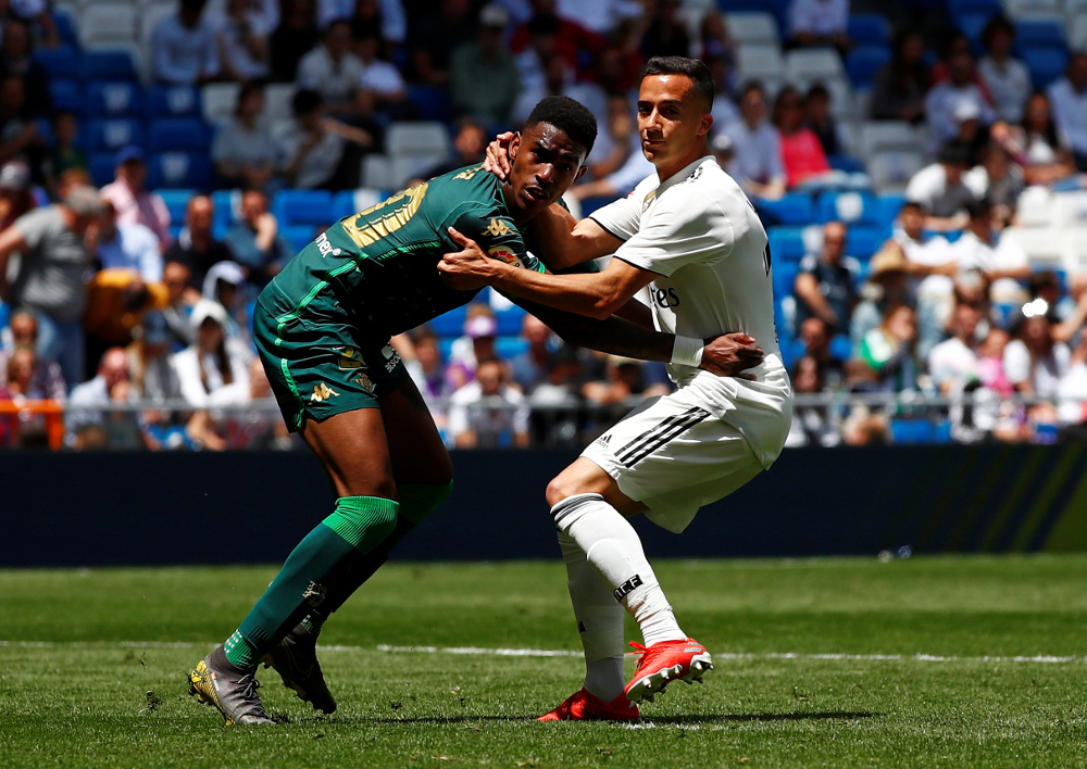 Real Betisu00e2u20acu2122 Junior Firpo in action with Real Madridu00e2u20acu2122s Lucas Vazquez during their La Liga Santander match at Santiago Bernabeu, Madrid May 19, 2019. u00e2u20acu201d Reuters pic