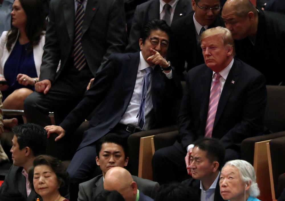 US President Donald Trump and Japanese Prime Minister Shinzo Abe watch the Summer Grand Sumo Tournament at Ryogoku Kokugikan Sumo Hall in Tokyo May 26, 2019. u00e2u20acu2022 Reuters pic