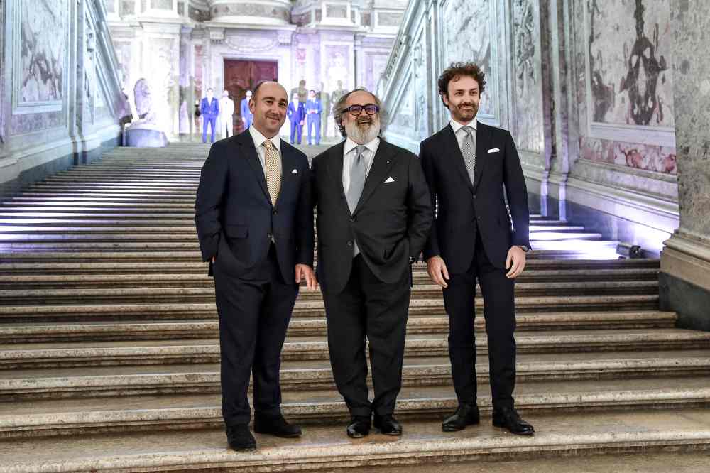 Italian luxury designer Stefano Ricci (centre) poses with his sons Niccolo (right) and Filippo, during a preview of his Spring/Summer 2020 collection, at 'Reggia di Caserta' in Caserta near Naples, on May 21, 2019. u00e2u20acu2022 AFP pic
