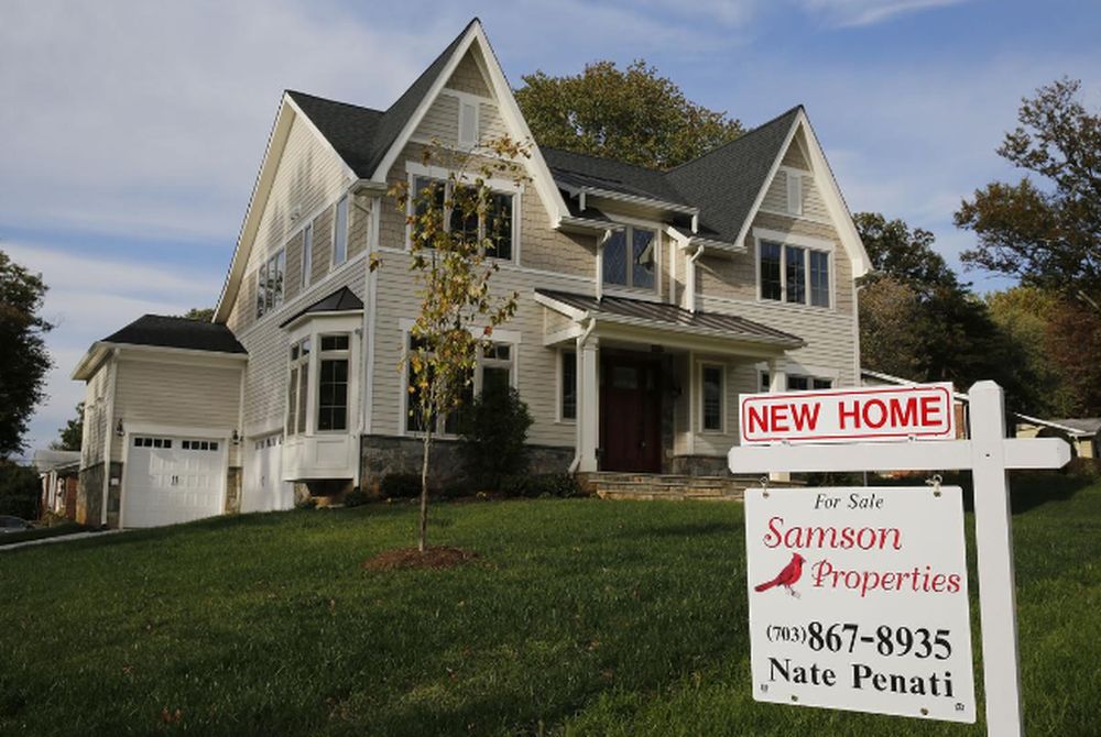 A real estate sign advertising a new home for sale is pictured in Vienna, Virginia, US, October 20, 2014. u00e2u20acu201d Reuters pic