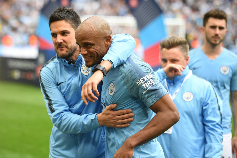 Manchester Cityu00e2u20acu2122s Belgian captain Vincent Kompany celebrates victory with teammates after the English FA Cup final football match between Manchester City and Watford at Wembley Stadium in London, May 18, 2019. u00e2u20acu201d AFP pic 