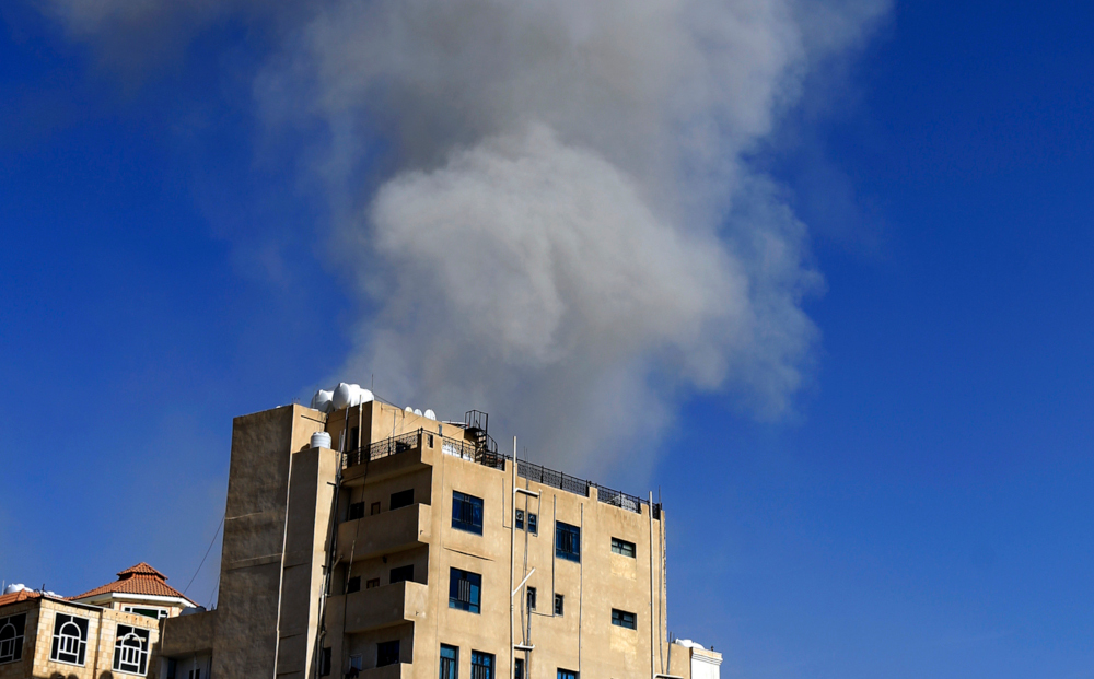 Smoke billows following an air strike in the Yemeni capital Sanaa May 16, 2019. u00e2u20acu201d AFP pic 