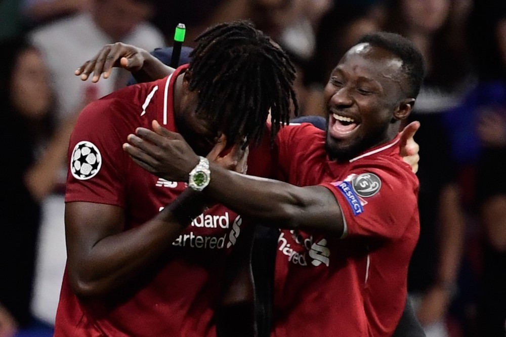 Liverpoolu00e2u20acu2122s Divock Origi (left) and Naby Keita celebrate after winning the Uefa Champions League final with Tottenham Hotspur at the Wanda Metropolitano Stadium in Madrid June 1, 2019. u00e2u20acu201d AFP pic