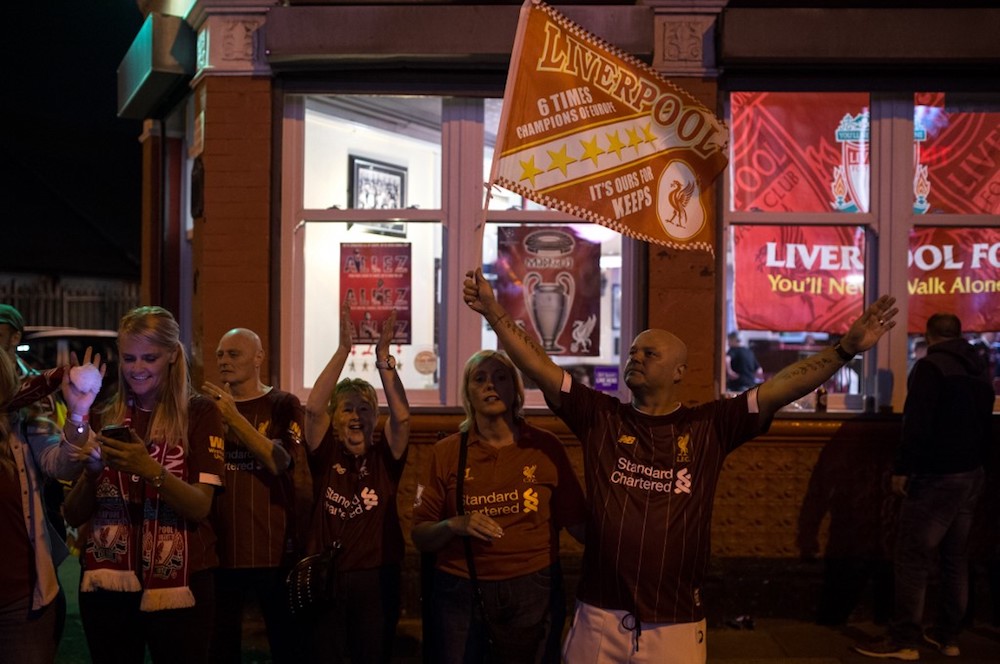 Liverpool supporters celebrate outside Anfield, following their team’s victory in the Uefa Champions League final with Tottenham Hotspur, in Liverpool June 1, 2019. — AFP pic